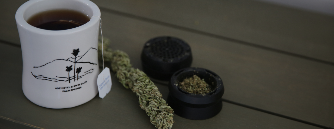 Cannabis tea and weed grinder