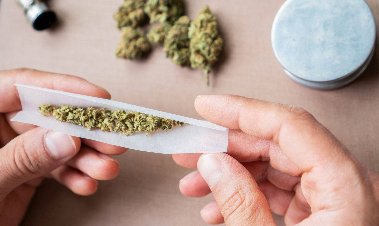 Hands rolling a baseball bat joint