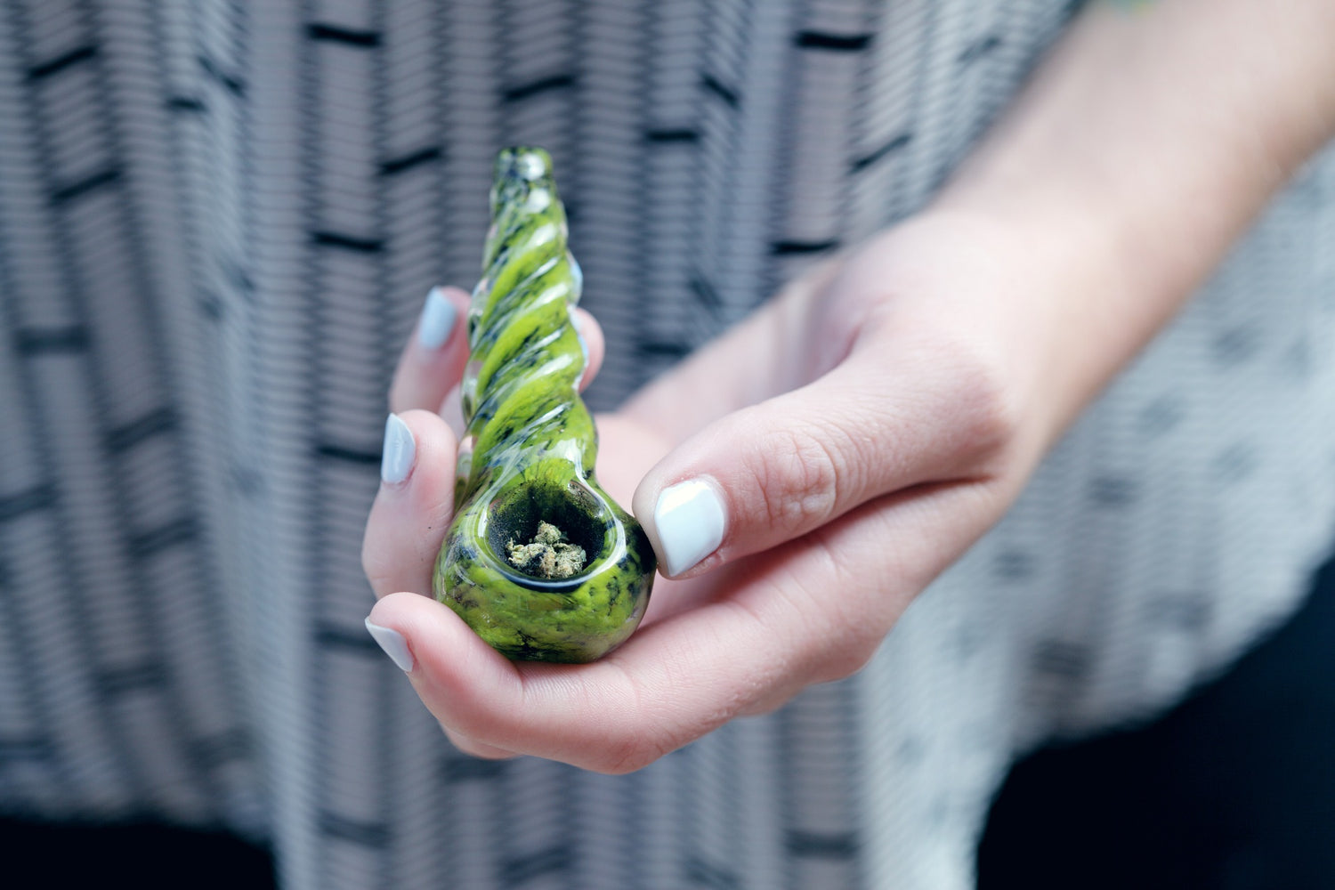 Hand holds a clean weed pipe