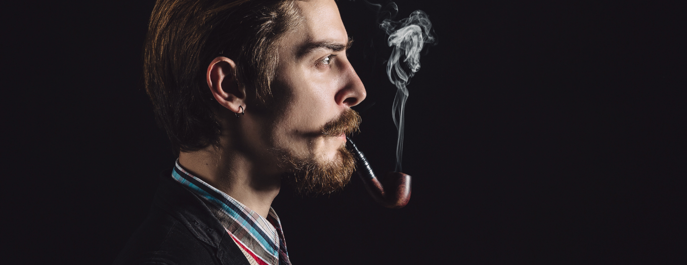 man smoking from a pipe