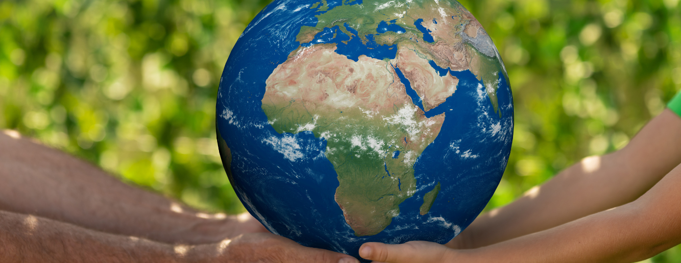 hands holding a planet Earth