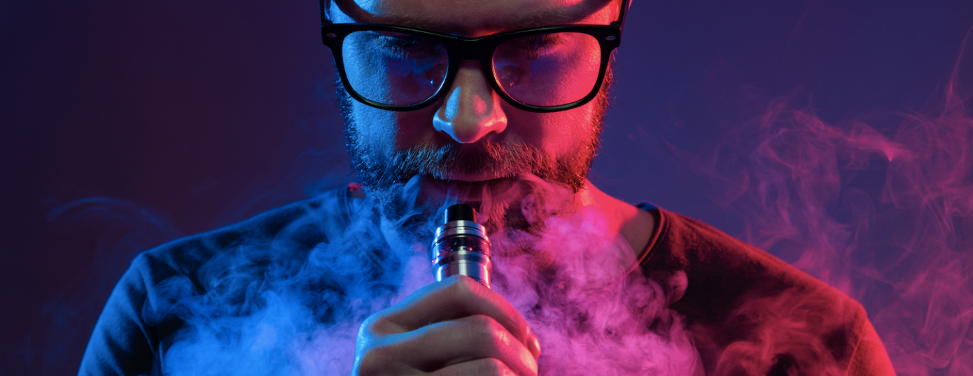 man smoking from a vape pen