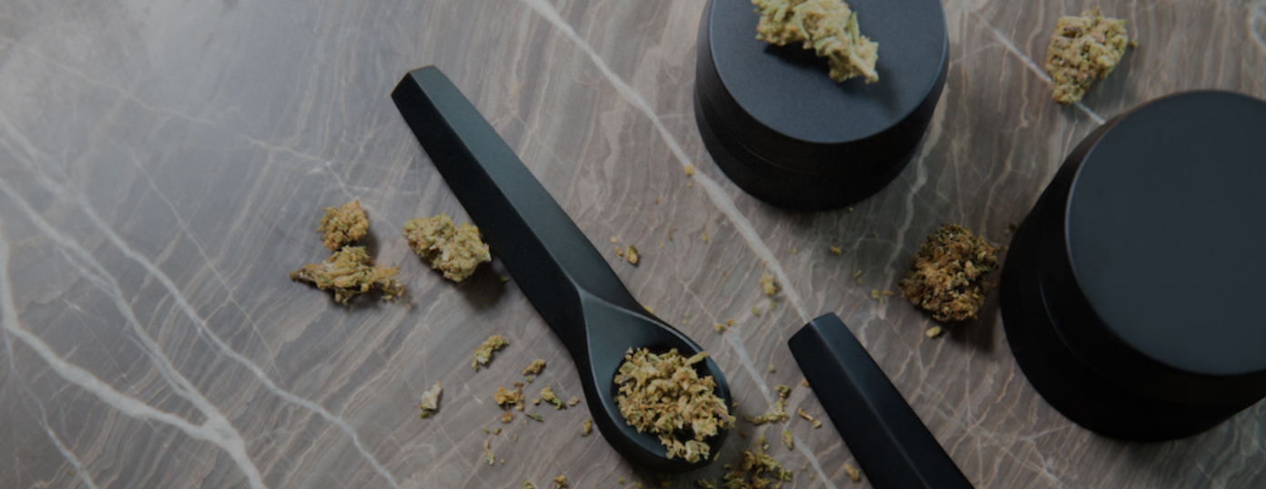 pipe, grinder and weed on table