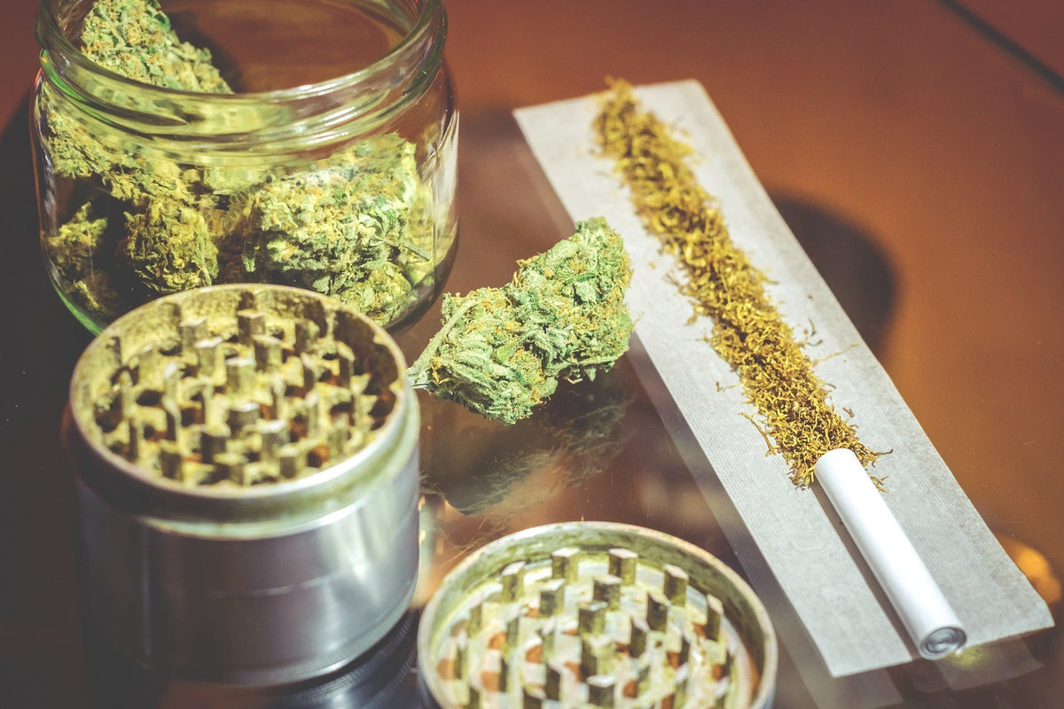 Metal weed grinder next to an open joint