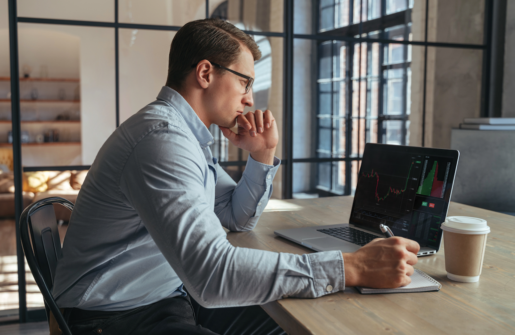 man looking at financial data