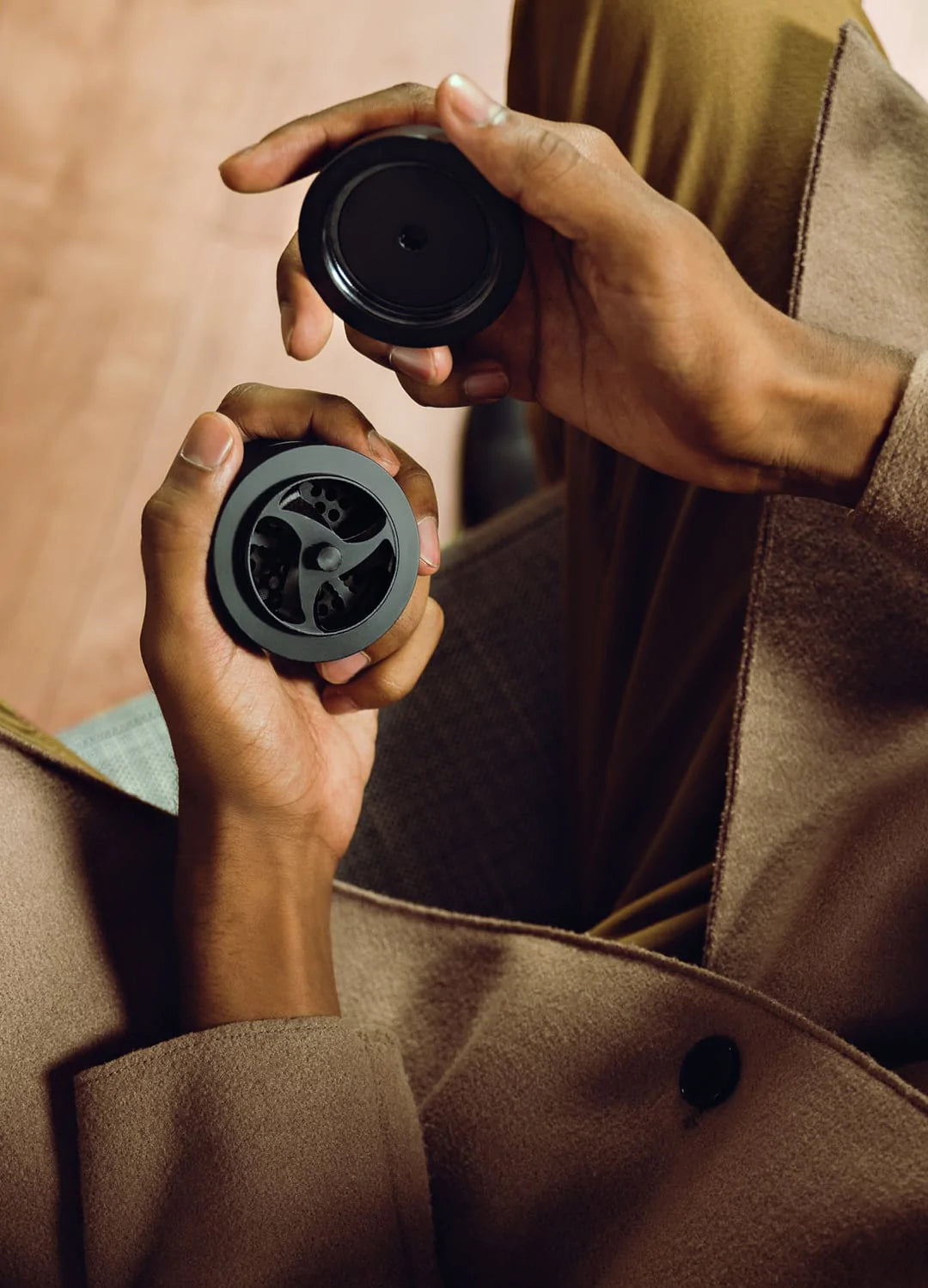 man holding an opened KLIP grinder with his hands
