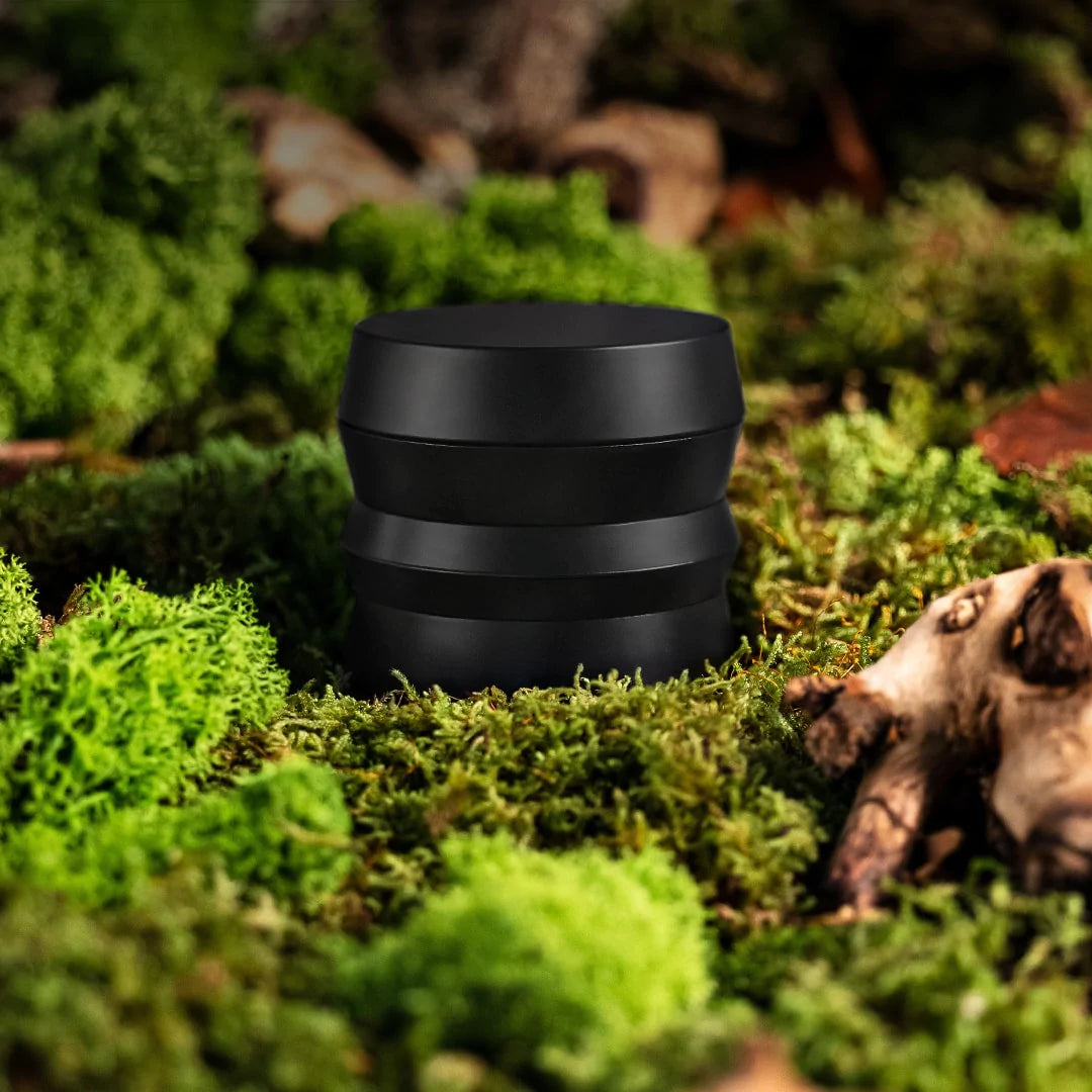 KLIP grinder over green herb