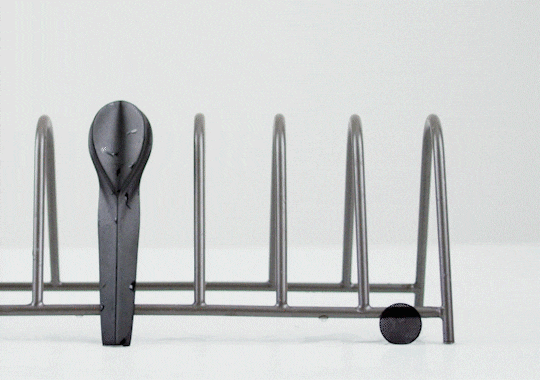 person sticking KOL pipe magnetically to a dish drainer to dry it - GIF