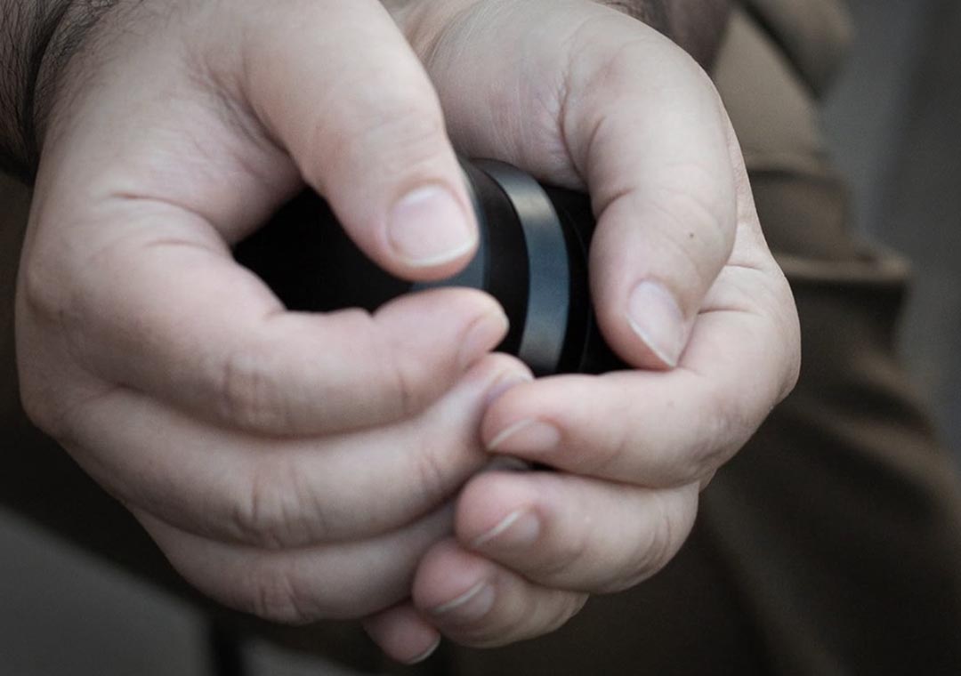 hands holding KLIP grinder