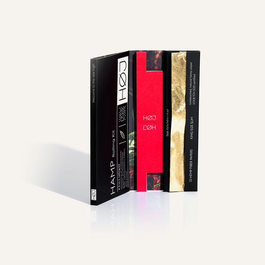 Open box of HAMP paper with red rolling filters and a gold leaf