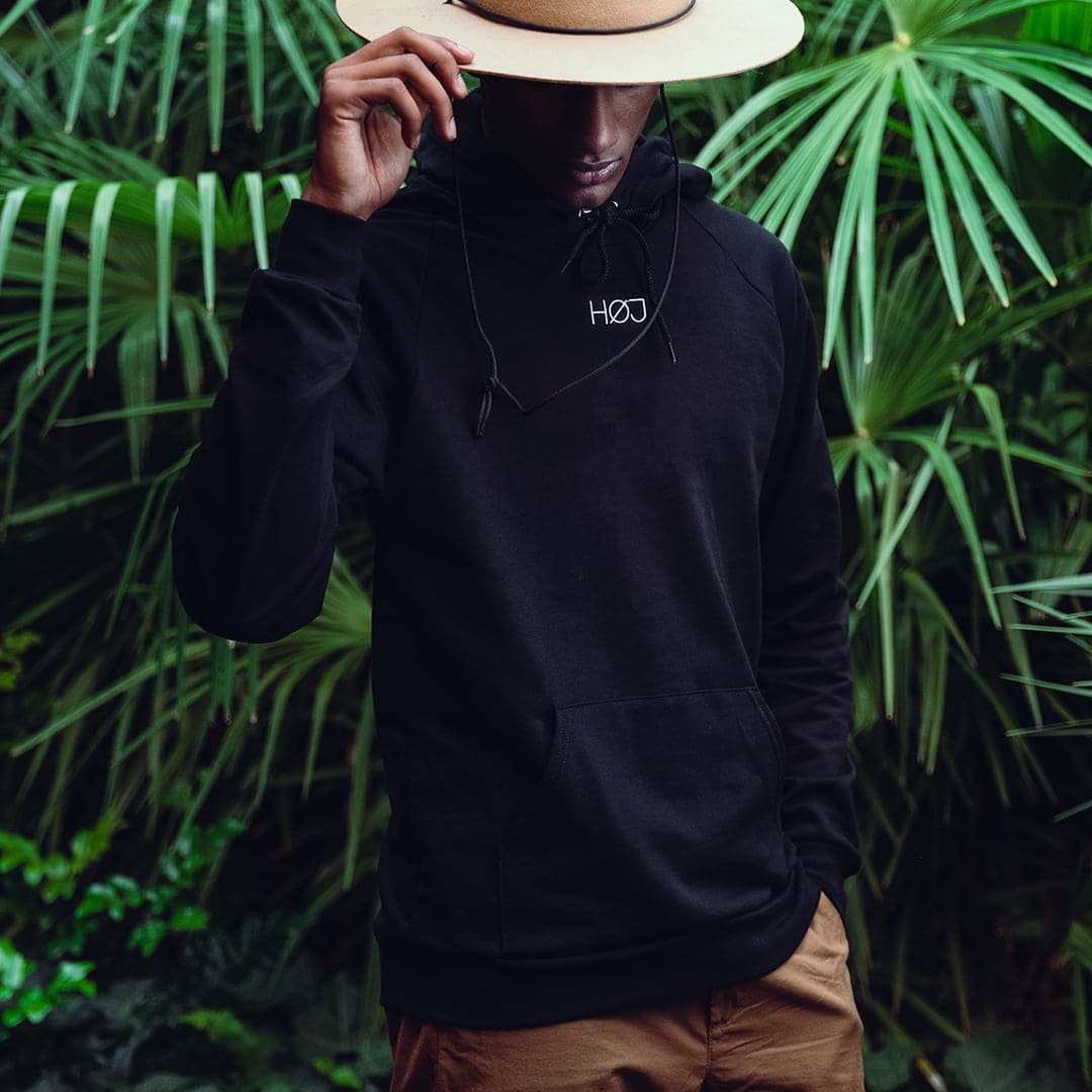 man with black HØJ hoodie