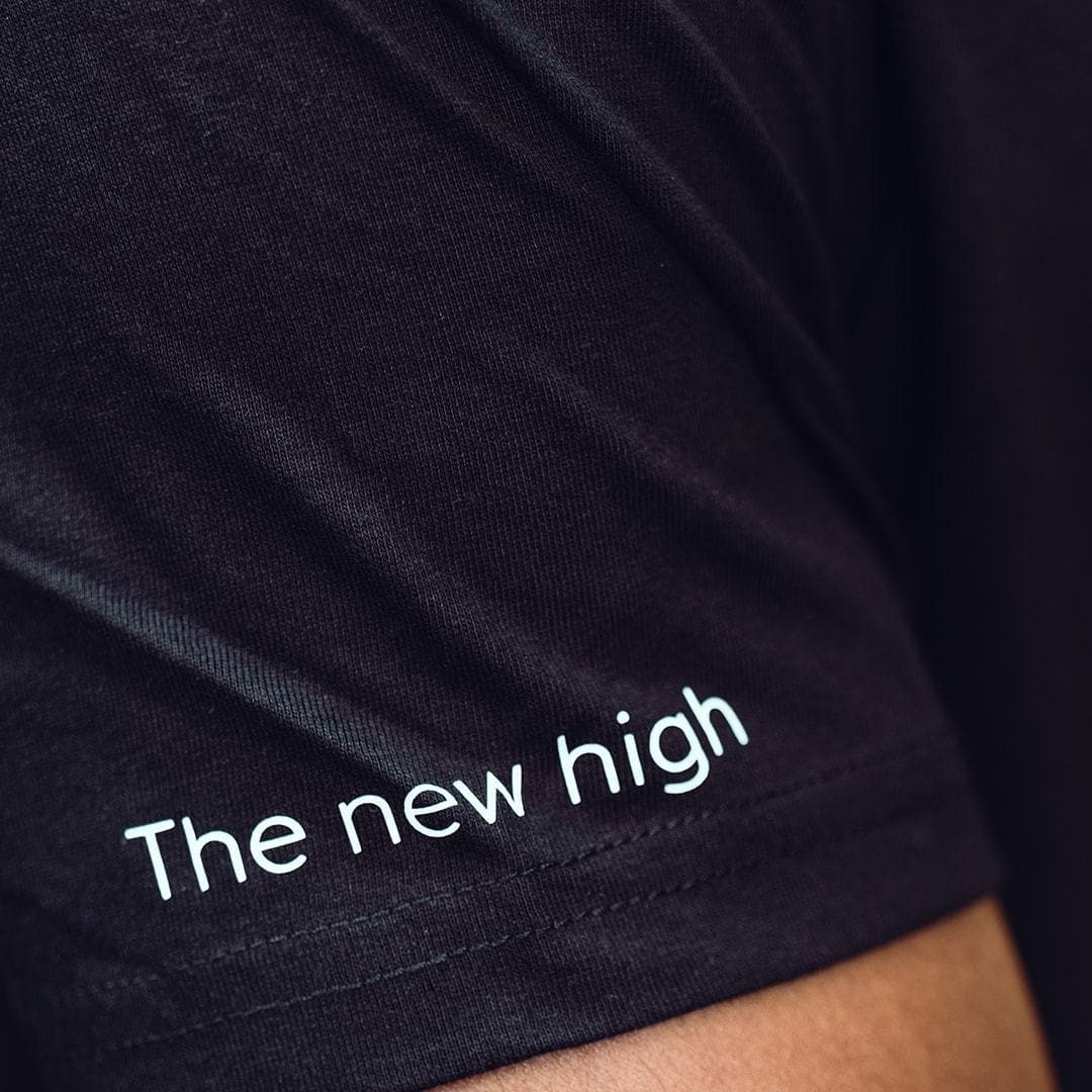 The new high quote on black tshirt sleve