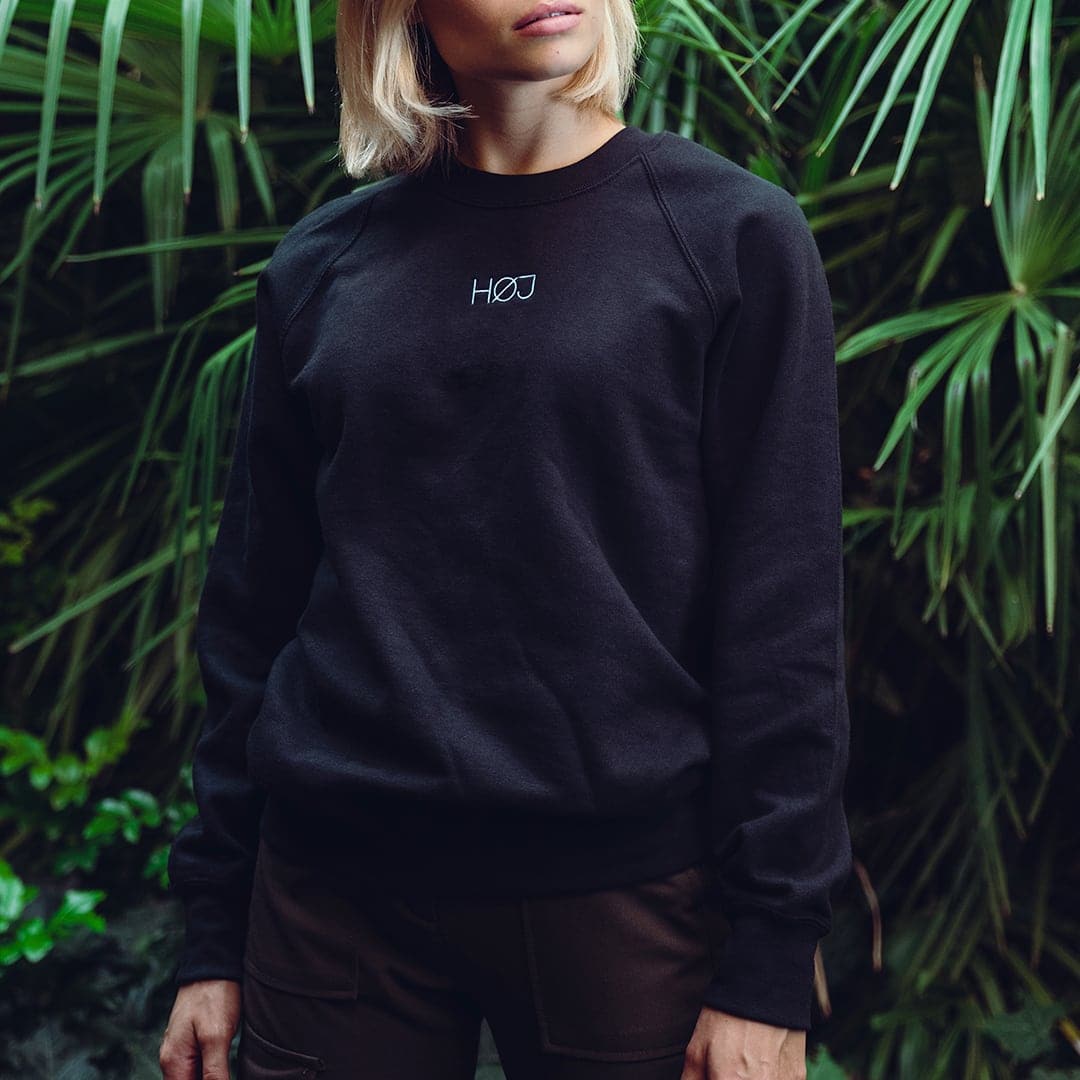 Woman with black HOJ sweatshirt