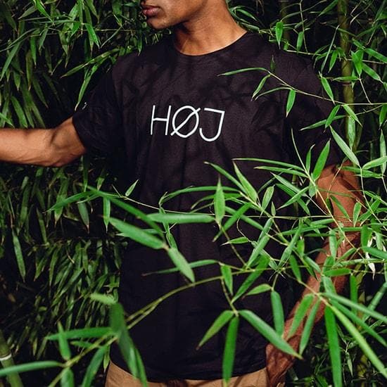 Man with black HOJ tshirt in nature