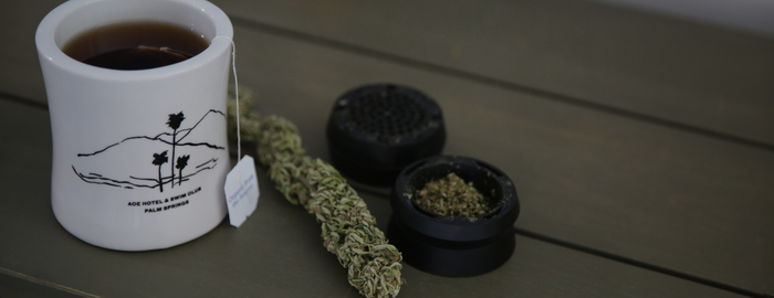 Cannabis tea and weed grinder