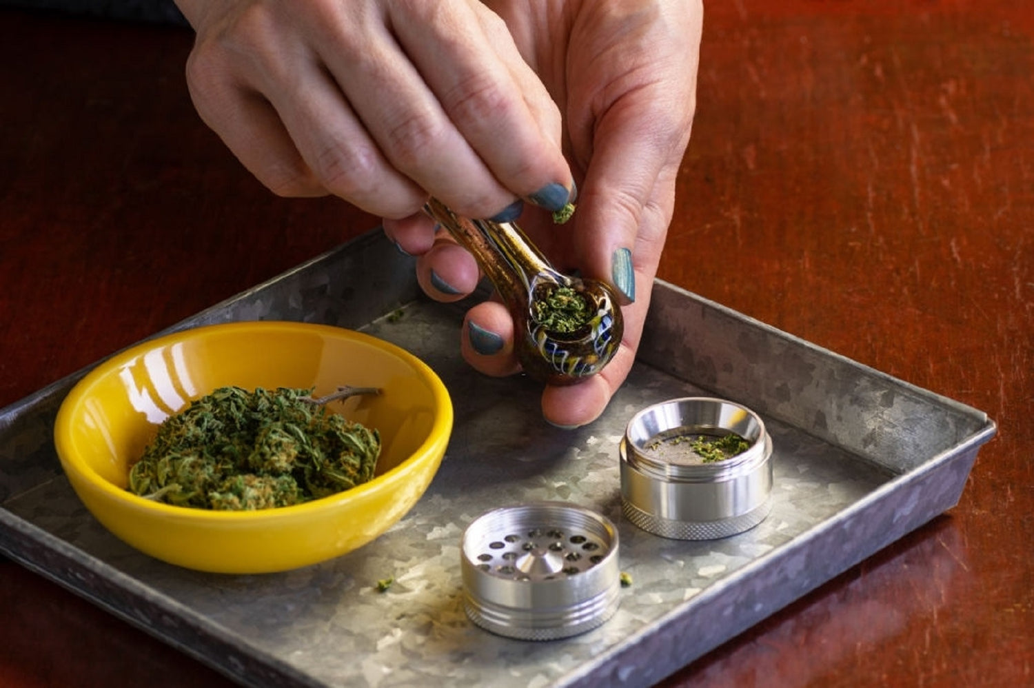 Hands packing a pipe for a cool smoke