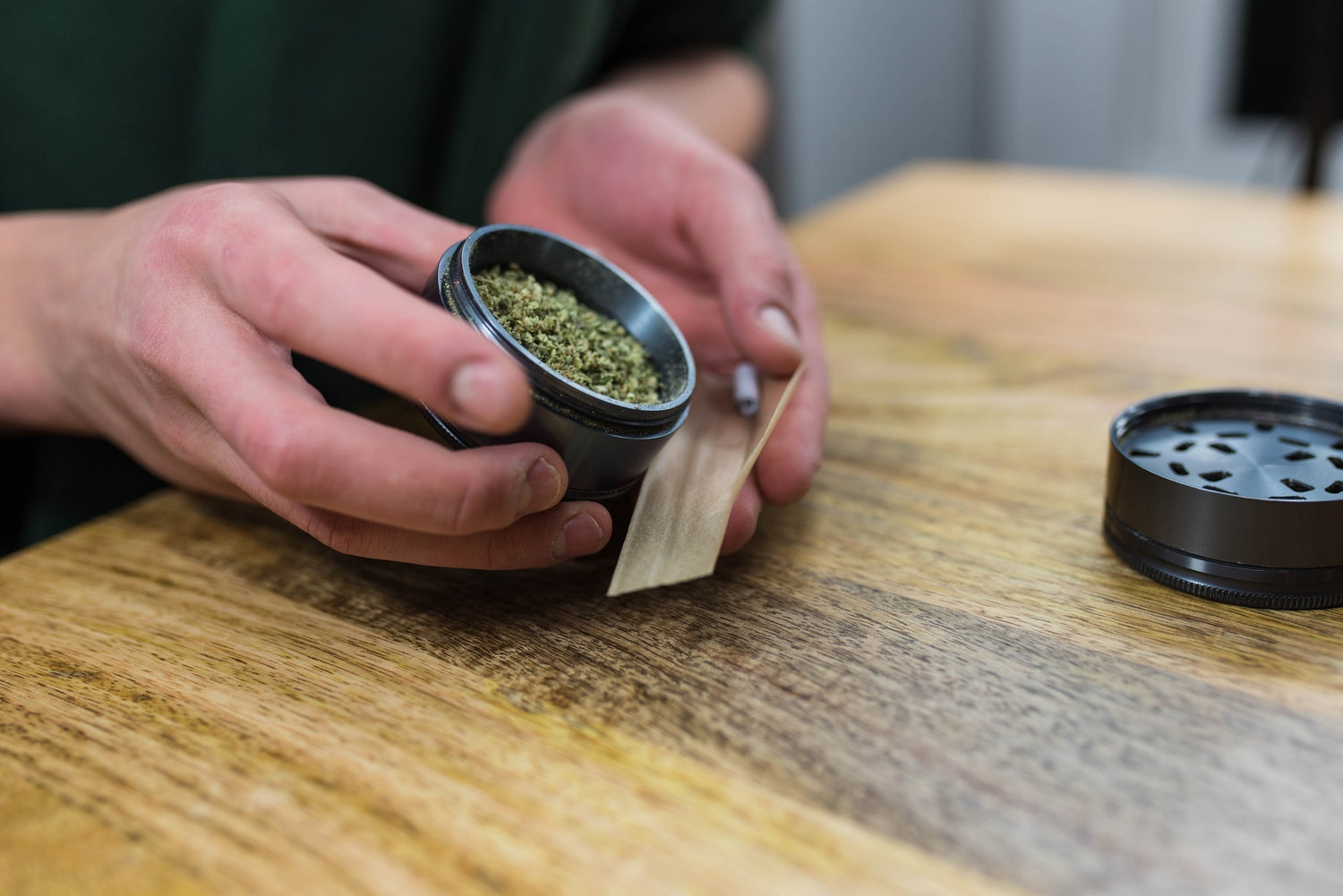 Hands rolling a diamond joint