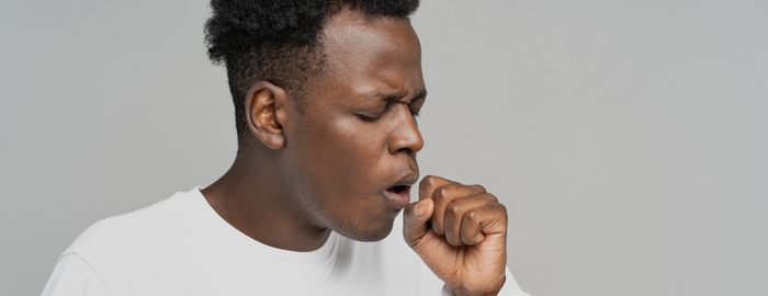 black man coughing