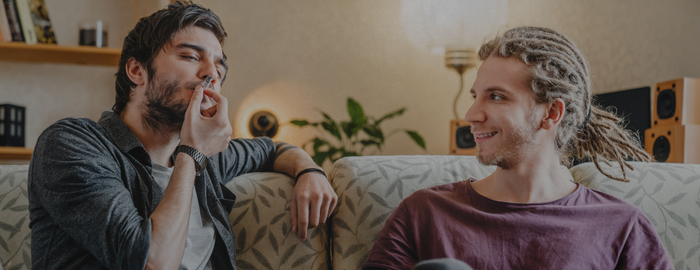 young men smoking a weed joint
