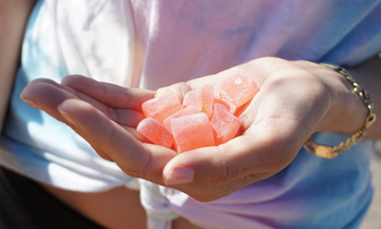Hand with CBD gummies
