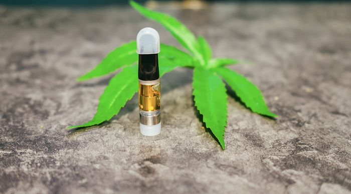 Delta 8 Cart with cannabis plant