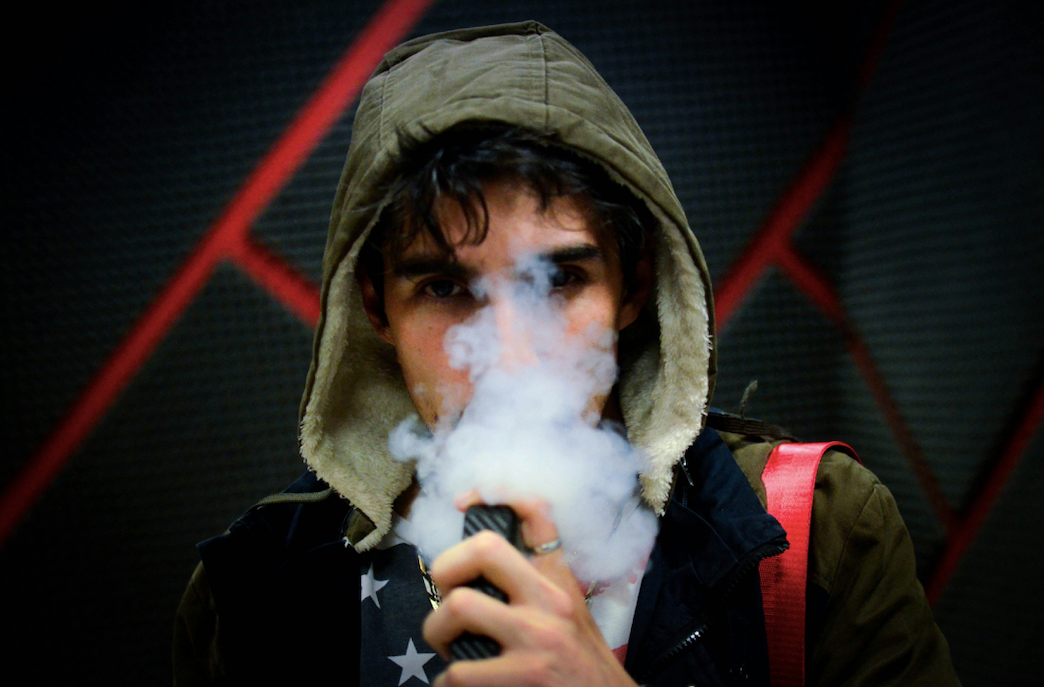 Guy smoking CBD from a vape