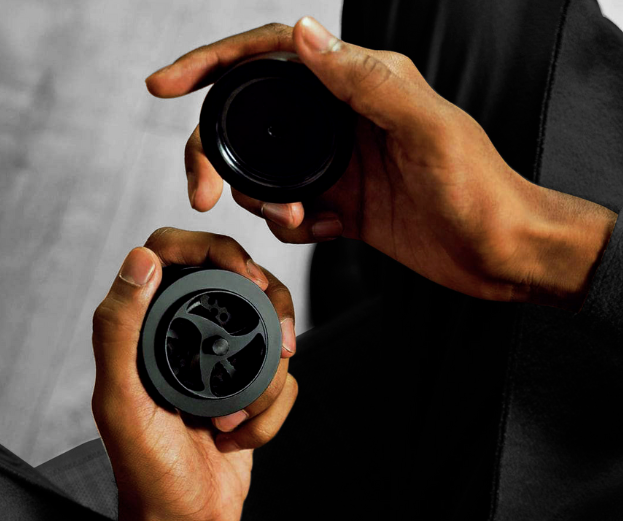 Hands holding KLIP grinder opened