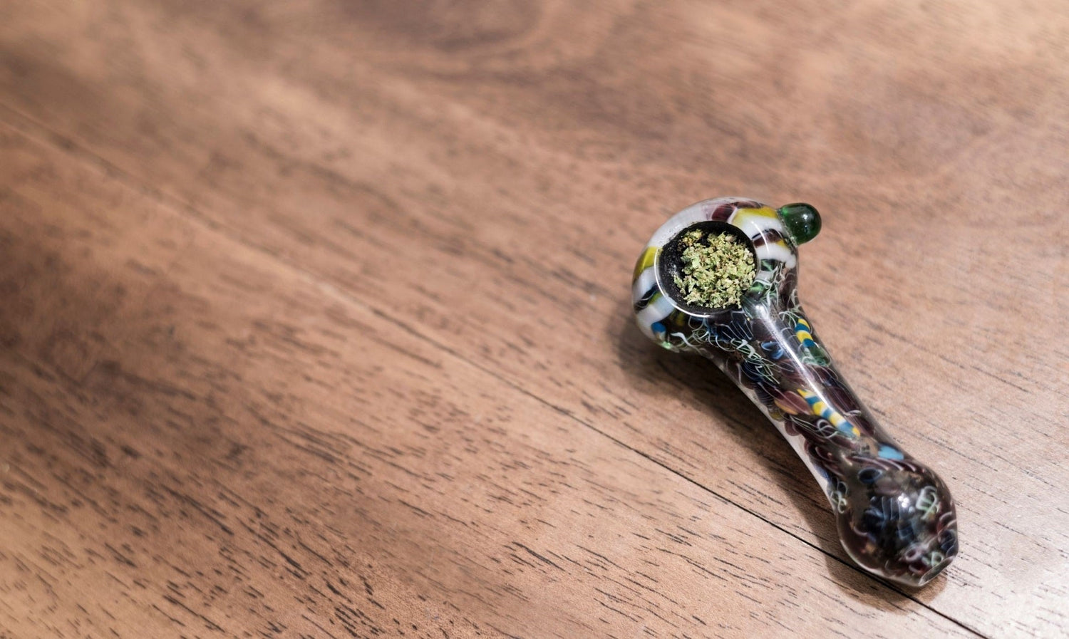 Glass pipe with cannabis inside.