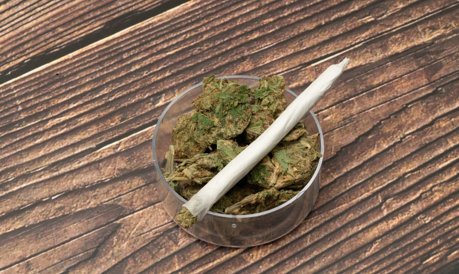 Perfectly rolled 3 skinner on top of cannabis buds