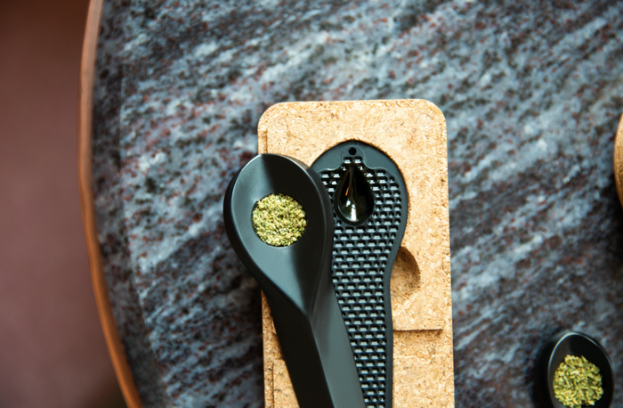 KOL pipe open with cannabis over its cork box