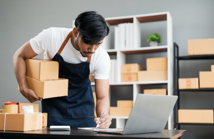 man managing his online store