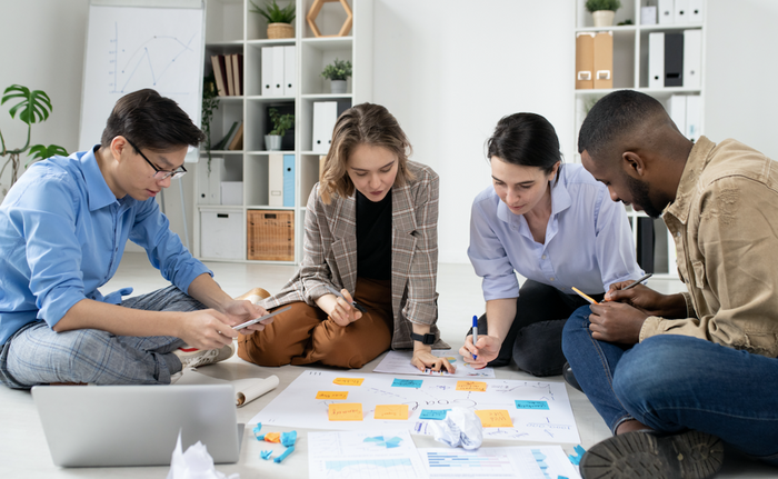 group of people planning a customer retention strategy