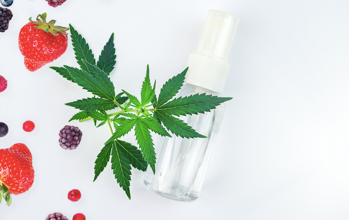 spray bottle with cannabis leaves