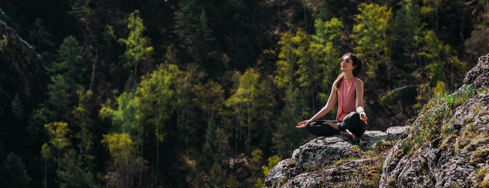woman practicing yoga in nature