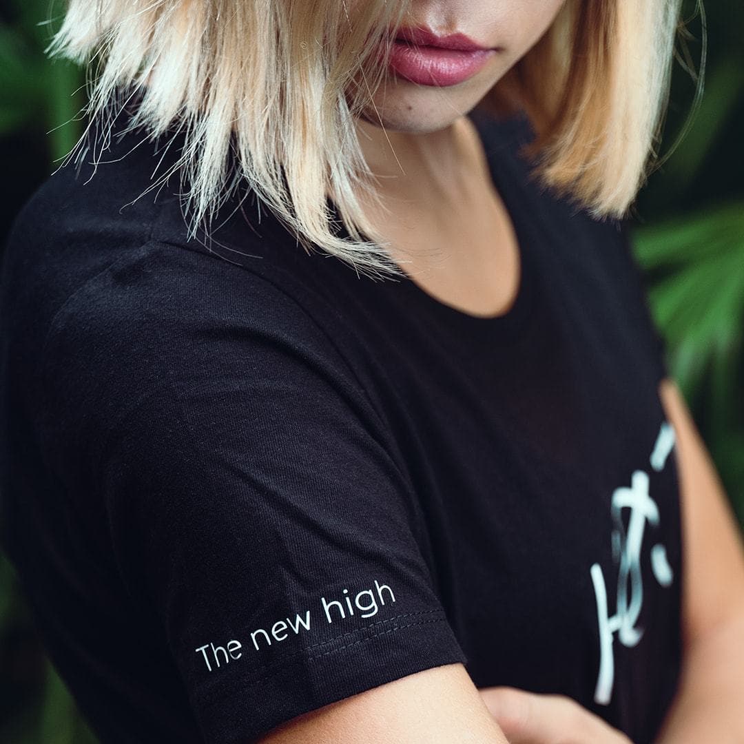 Blonde woman with black HOJ tshirt 