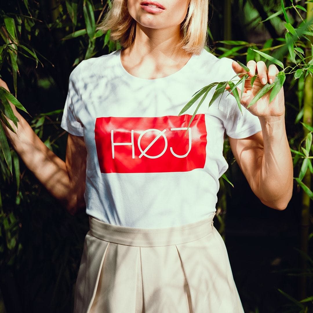 Blonde woman with white HOJ tshirt 